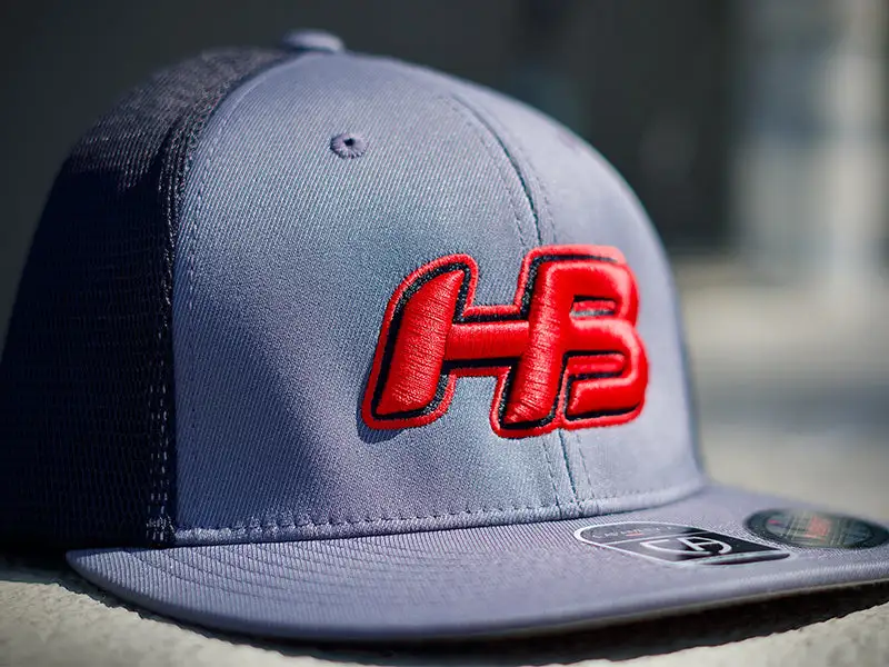 HB Sports Headbanger Sports I8501 Cap America Flexfit Performance Trucker Mesh Back Hat: Graphite / Red 4 HB Sports Headbanger Sports I8501 Cap America Flexfit Performance Trucker Mesh Back Hat: Graphite / Red - Image 2